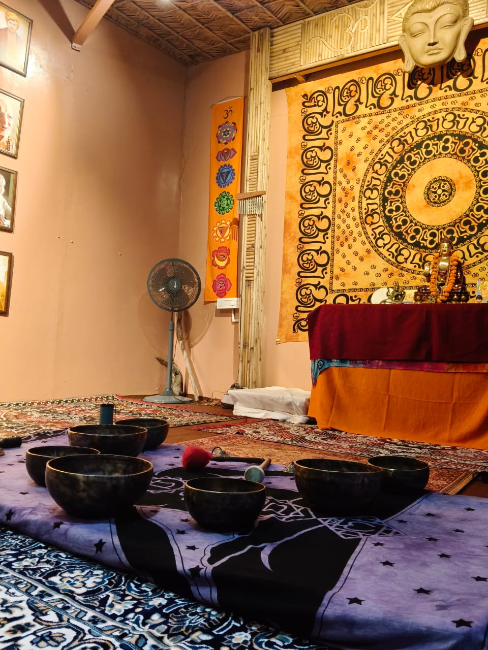 Sacred altar with singing bowls and Om mandala tapestry
